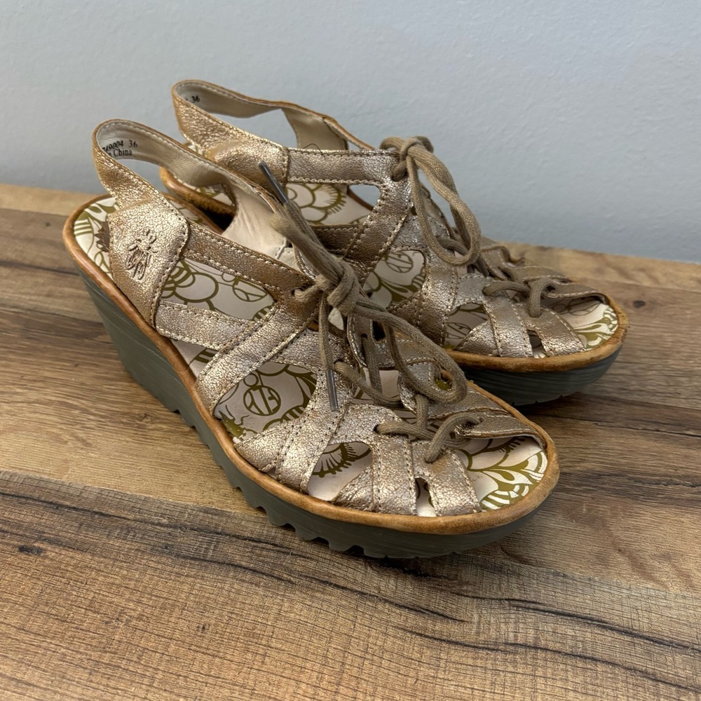 FLY London Yapi Metallic Gold Leather Ghillie Wedge Sandals
